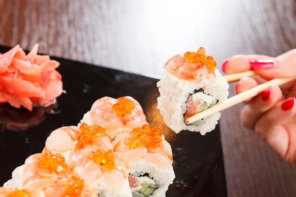 Sushi with chopsticks — Stock Photo, Image