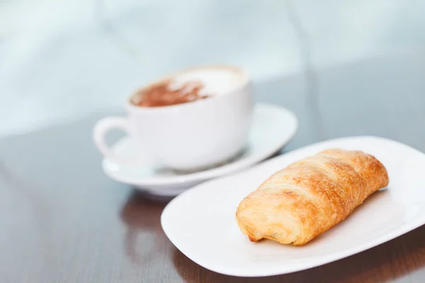 Coffee with puff pastry — Stock Photo, Image