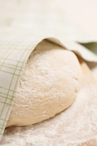 Dough on wooden board — Stock Photo, Image