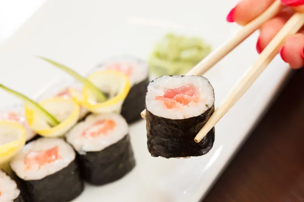 Sushi with chopsticks — Stock Photo, Image