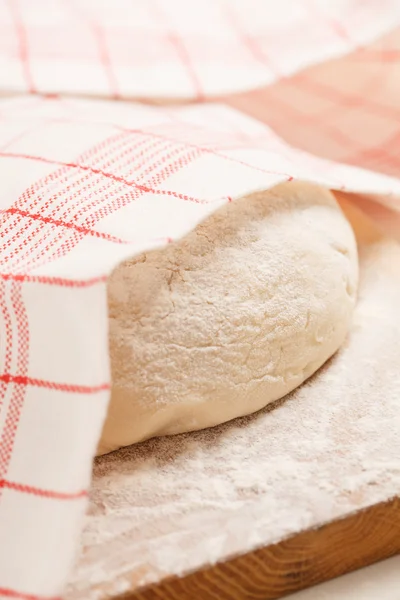 Dough on wooden board — Stock Photo, Image