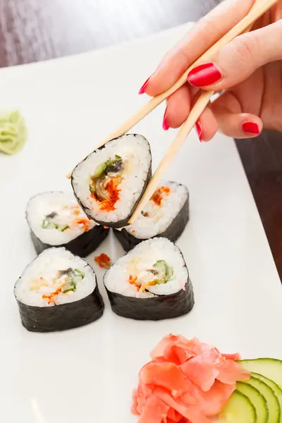 Sushi with chopsticks — Stock Photo, Image