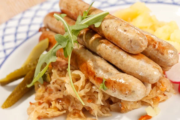 Sausages with cabbage — Stock Photo, Image