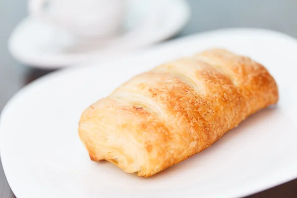 Coffee with puff pastry — Stock Photo, Image