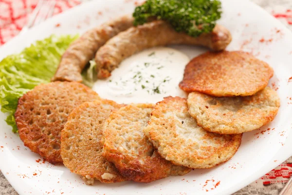 Potato pancakes with sausage — Stock Photo, Image