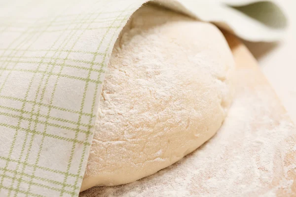 Dough on wooden board — Stock Photo, Image