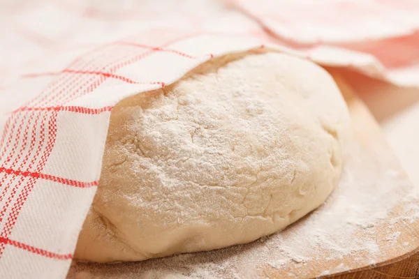 Dough on wooden board — Stock Photo, Image