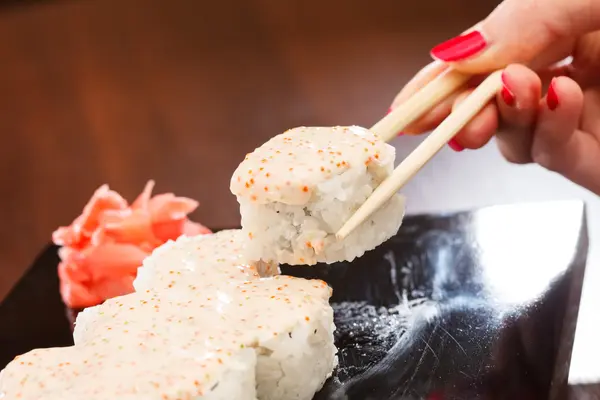 Sushi with chopsticks — Stock Photo, Image