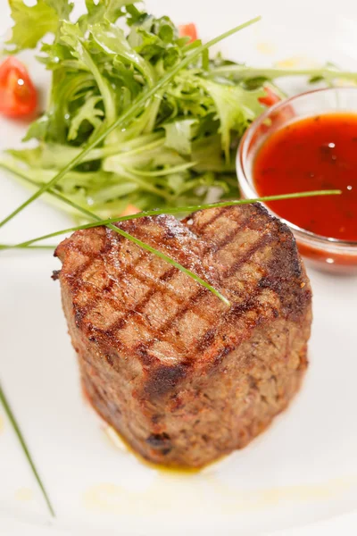 Grilled steak with sauce — Stock Photo, Image