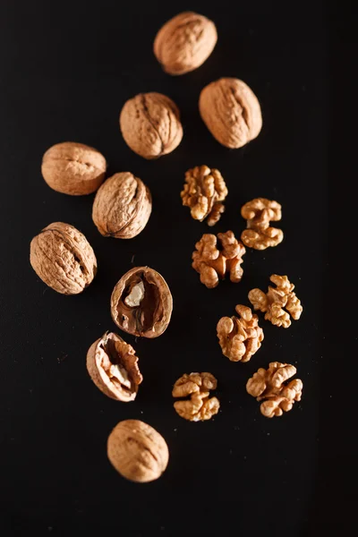 Walnuts on black background — Stock Photo, Image