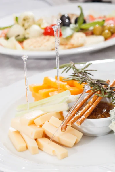 Cheese plate with grapes and honey — Stock Photo, Image