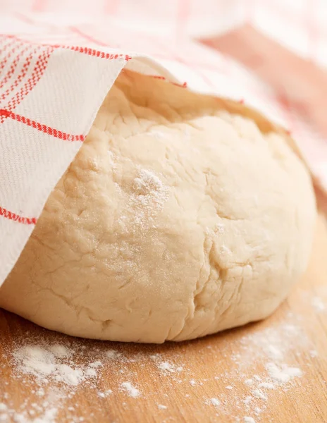 Dough on wooden board — Stock Photo, Image