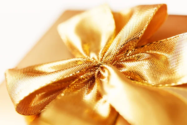 Present with gold bow — Stock Photo, Image