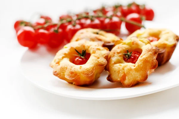 Cakes with cherry tomatoes — Stock Photo, Image