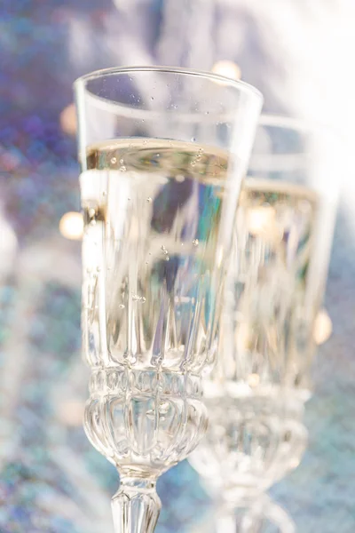 Champagne glasses on celebration table — Stock Photo, Image