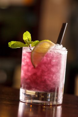 Cocktail with blackberries and straw clipart