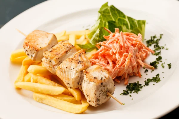 Chcken kebab with french fries — Stock Photo, Image