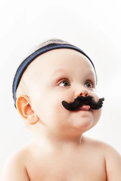 Söt baby med mustascher — Stockfoto