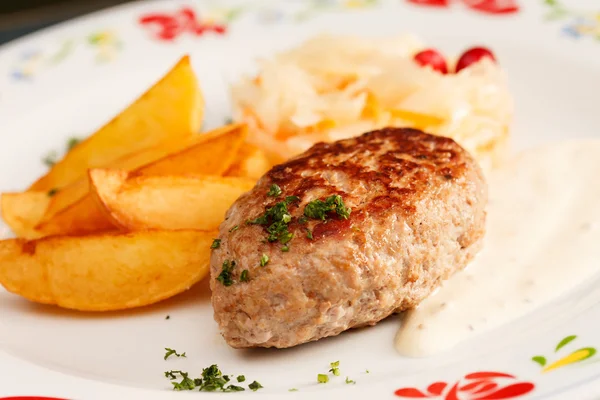 Cutlet with potatoes — Stock Photo, Image