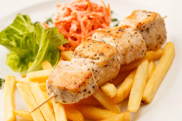 Chicken kebab with french fries — Stock Photo, Image