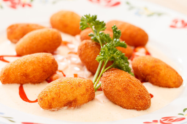 Potato balls with sauce