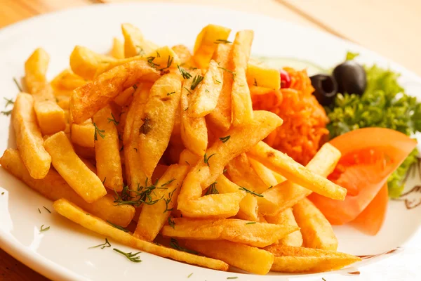 French fries with vegetables — Stock Photo, Image