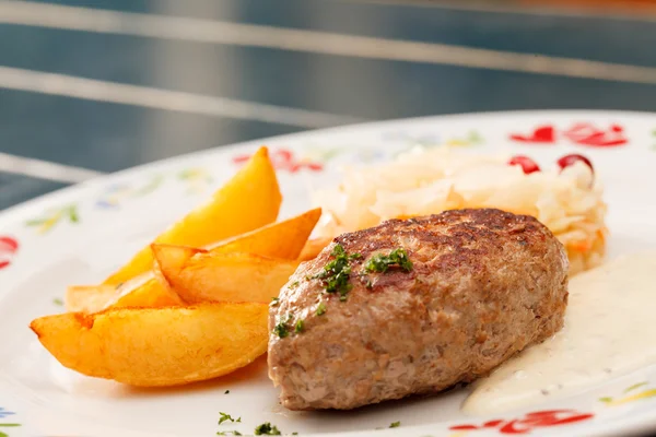 Cutlet with potatoes — Stock Photo, Image
