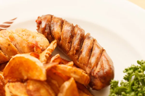 Sausages with potatoes — Stock Photo, Image
