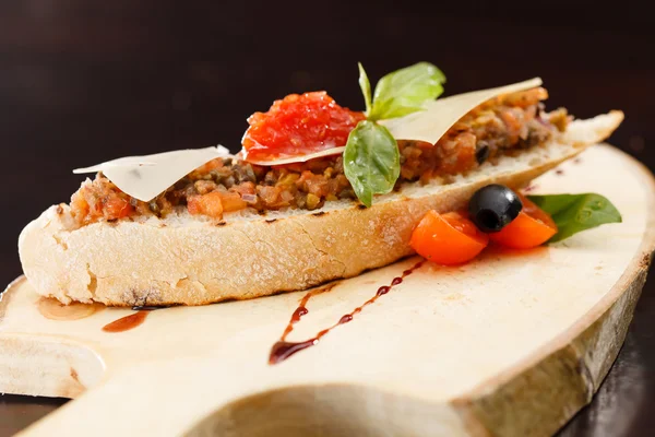 Appetizer bruschetta with tomato — Stock Photo, Image