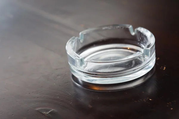 Ashtray on wood table — Stock Photo, Image