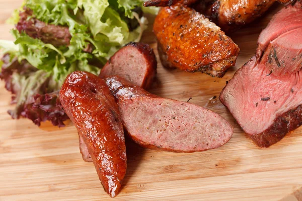 Sausages on cutting board — Stock Photo, Image