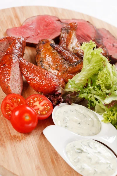 Sausages on cutting board — Stock Photo, Image