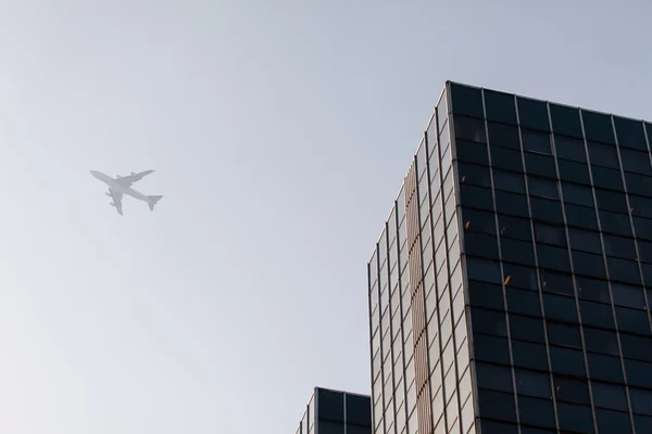 Modern buildings and aircraft — Stock Photo, Image