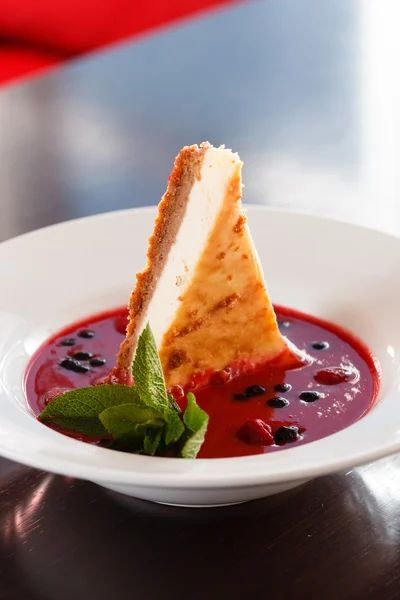Cheesecake with berry sauce — Stock Photo, Image