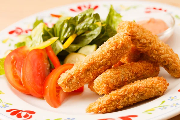 Fish fingers with vegetables — Stock Photo, Image