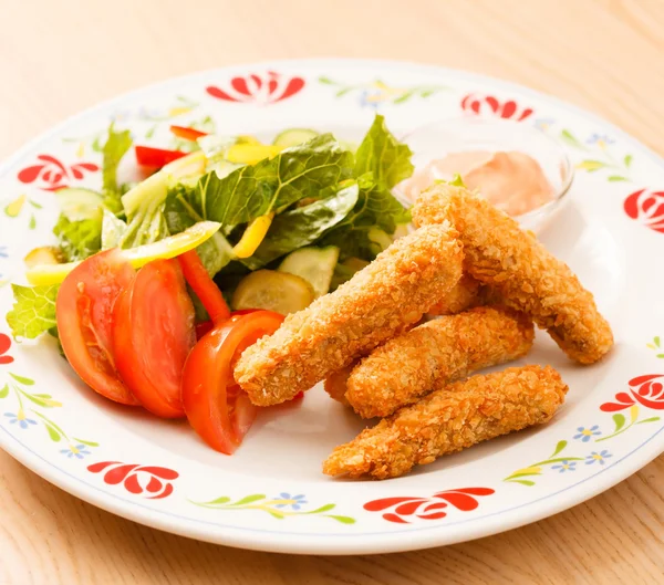 Fish fingers with vegetables — Stock Photo, Image