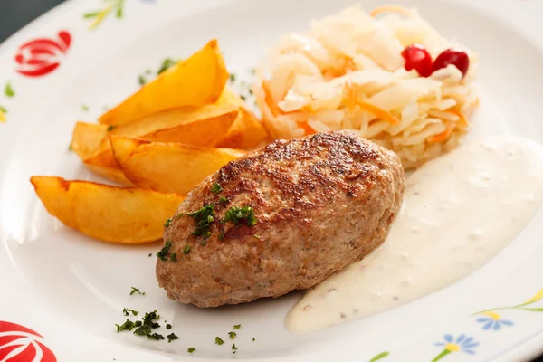Cutlet with potatoes — Stock Photo, Image