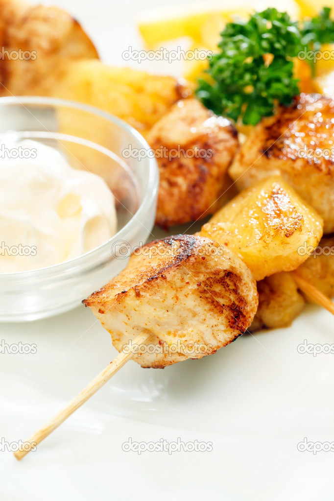 Chicken skewers with french fries