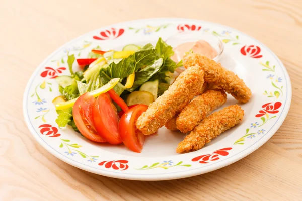 Fish fingers with vegetables — Stock Photo, Image