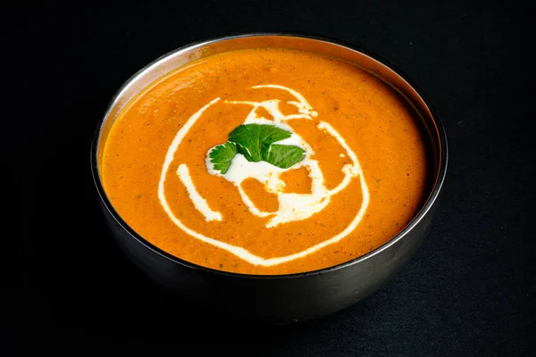 indian soup on the black background