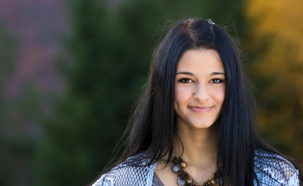 Portrait close up of young beautiful woman, on green background nature. — Stock Photo, Image