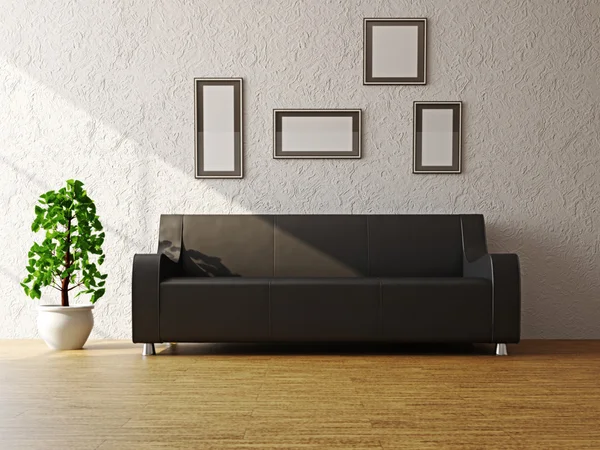 Черный диван у стены — стоковое фото