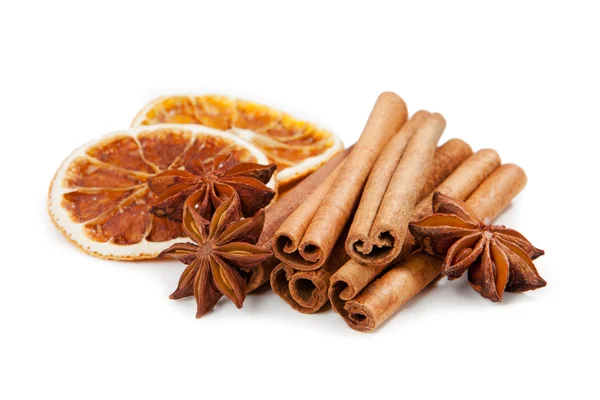 Anis, cinnamon and orange on white background — Stock Photo, Image