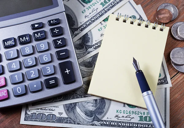 Concept - business.Calculator, money, notebook and pen on the ta — Stock Photo, Image