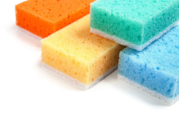 Color sponges isolated on a table on a white background — Stock Photo, Image
