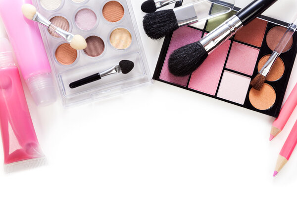 Makeup brush and cosmetics, on a white background isolated