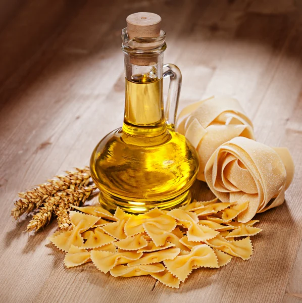 Pasta and oil in a glass — Stock Photo, Image