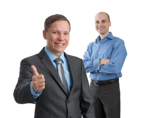 Smiling young business man with thumbs up gesture — Stock Photo, Image