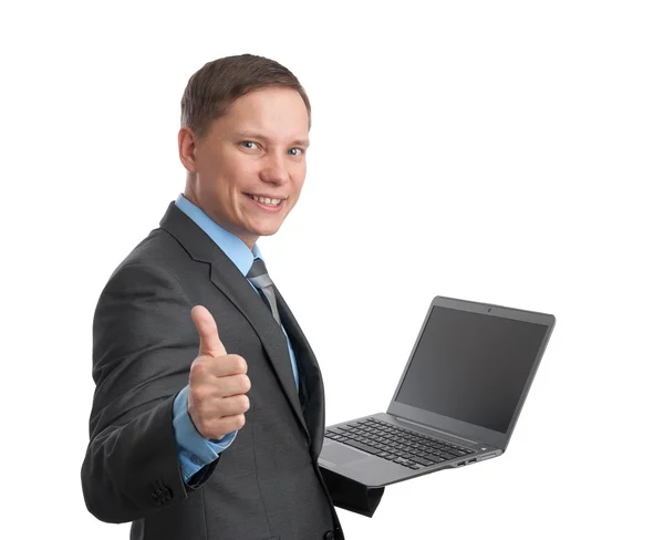 Бизнесмен держит ноутбук и показывает большой палец вверх — стоковое фото