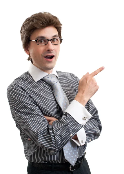 Surprised young business man pointing at something interesting — Stock Photo, Image
